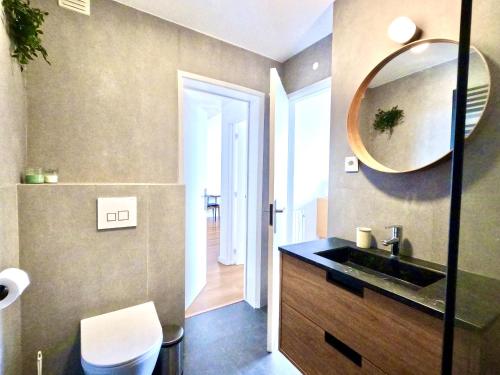 a bathroom with a sink and a mirror on the wall at Peaceful & panoramic views apartment, Cascais in Cascais