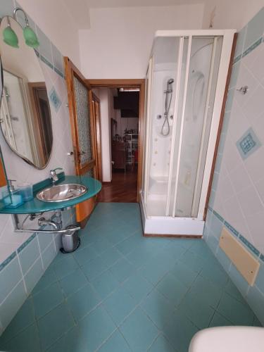 a bathroom with a sink and a shower at B&B Corallo in Sassari