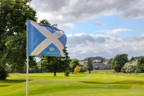 a flag in front of a golf course at Dalmahoy Hotel & Country Club in Edinburgh