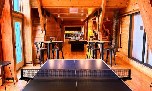 a ping pong table in the middle of a room at NewVida Preserve in Wilmington