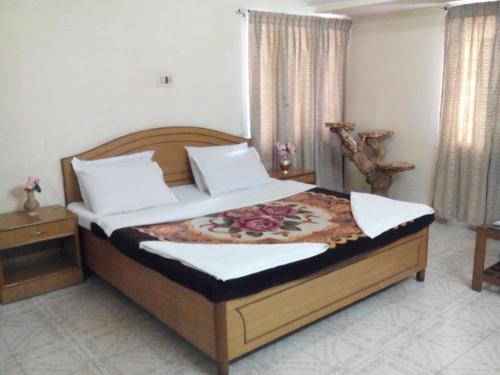 Postel nebo postele na pokoji v ubytování Rainbow Cottages-Budget Friendly rooms