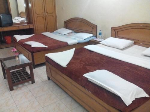 Postel nebo postele na pokoji v ubytování Rainbow Cottages-Budget Friendly rooms