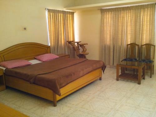 Postel nebo postele na pokoji v ubytování Rainbow Cottages-Budget Friendly rooms