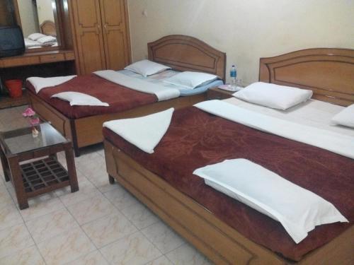 Postel nebo postele na pokoji v ubytování Rainbow Cottages-Budget Friendly rooms