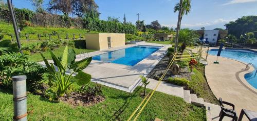 an overhead view of a swimming pool in a yard at ApartaSol Reserva de la Colina in La Tebaida