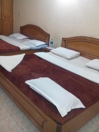 Postel nebo postele na pokoji v ubytování Rainbow Cottages-Budget Friendly rooms