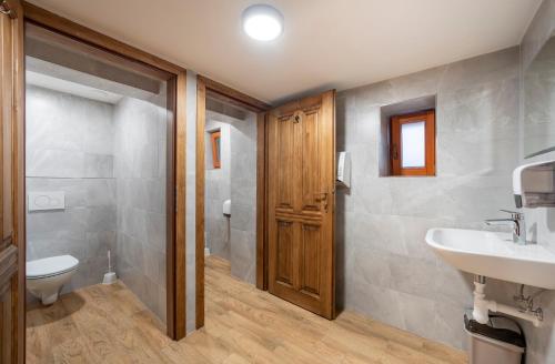 a bathroom with a toilet and a sink at Horská bouda Krakonoš in Černý Dŭl