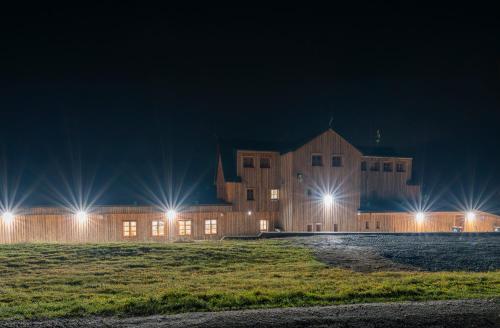 a large building at night with lights on at Horská bouda Krakonoš in Pec pod Sněžkou