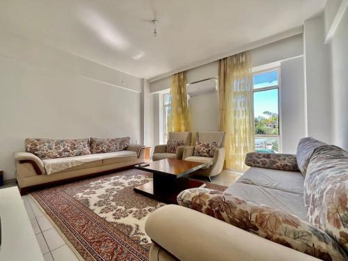 a living room with a couch and a table at *Downtown* Furnished Flat [Mounthly Discount] D3 in Antalya
