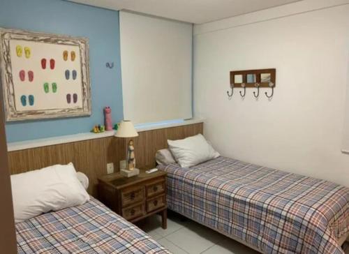 Кровать или кровати в номере Condomínio Portamaris Resort