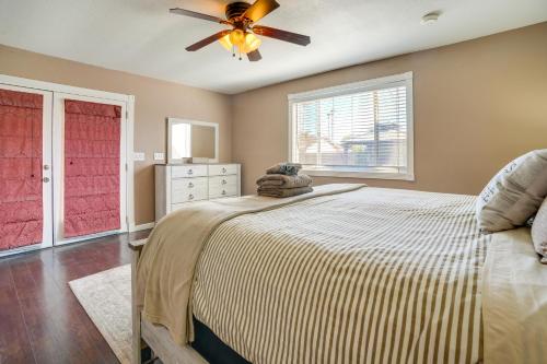a bedroom with a bed and a ceiling fan at Family-Friendly Peoria Retreat with Private Pool! in Peoria