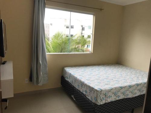 En eller flere senge i et værelse på Condomínio Residencial Marina Clube