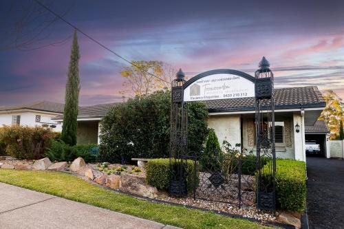 a gate in the front of a house at Toowoomba Hospital Apartments in Rockville