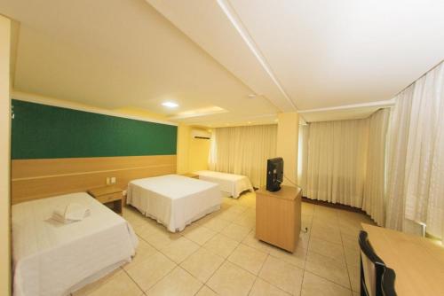 Una cama o camas en una habitación de POUSADA CASAGRANDE