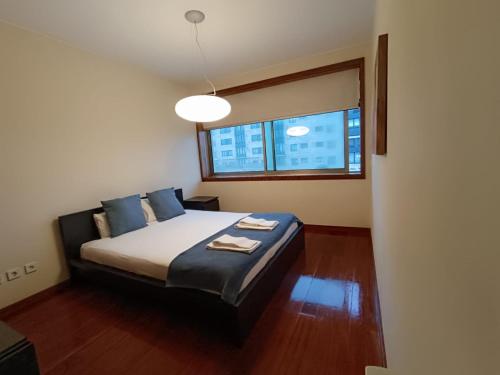Postel nebo postele na pokoji v ubytování Boa Nova Lighthouse Flat