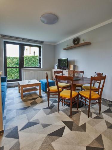 a living room with a table and chairs at Apartmán u Martina in Jablonec nad Nisou