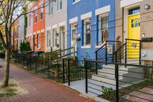 a row of colorful houses on a city street at Reside NoMa, a Wyndham Residence in Washington