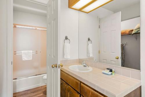 a bathroom with a sink and a mirror at 1 Sky Lake - walk to town in Incline Village