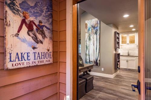 a wall with a sign that reads lake teton love is in the air at 128 McCloud - Luxury Couples Retreat in Incline Village