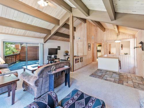 a living room with a couch and a table at Perfect location walk to town and nature in Incline Village