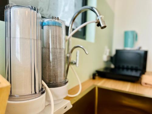 a blender sitting on top of a kitchen counter at Urban Suite Cozy Family Homestay at Georgetown by URBAN STAYCATION HENG LOD in Jelutong