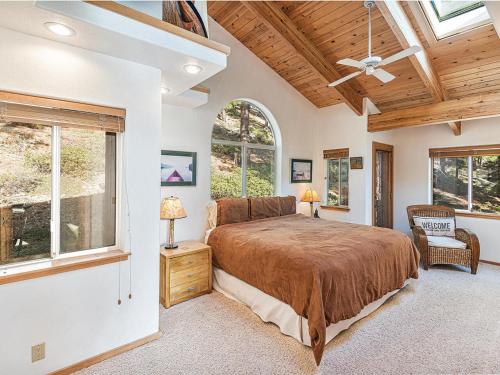 a bedroom with a bed and a ceiling fan at Fantastic Lakeview house with large decks! in Incline Village
