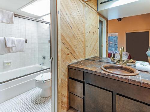 a bathroom with a sink and a toilet and a shower at 168 Forest Pines - walk to Lakeshore Blvd community pool and hot tub in Incline Village