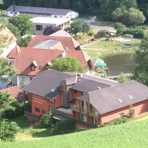 an overhead view of a group of houses with a field at Seegasthof Breineder - Familien & Seminarhotel in Mönichwald