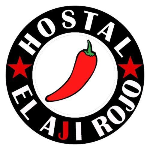 a sign with a chili pepper and the words houstonarmaarma at Hostal El Aji Rojo in Caldera