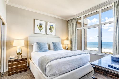 a bedroom with a bed with a view of the ocean at Marco Beach Ocean Resort 1202 in Marco Island