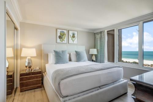 a bedroom with a bed with a view of the ocean at Marco Beach Ocean Resort 1102 in Marco Island