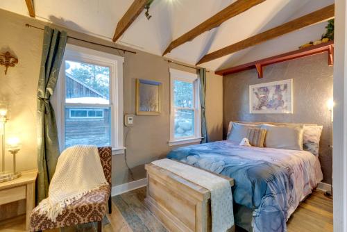 a bedroom with a bed and a window at Rustic Log Cabin with Studio about 5 Mi to Pikes Peak! in Green Mountain Falls