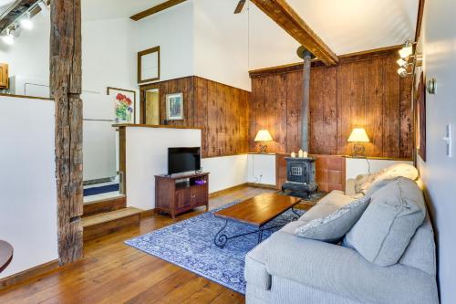 a living room with a couch and a stove at Chagrin Falls Home about 2 Mi to Town! in Chagrin Falls