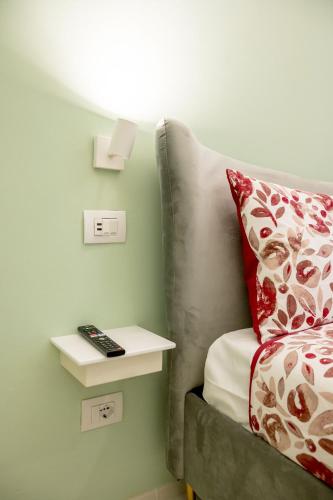 Una cama o camas en una habitación de GLAM PARMA