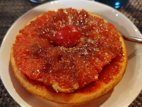 a plate of food with a sauce on top at Sheridan House Inn- Adult Only Accommodation in Williams