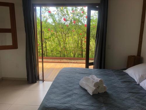 Postel nebo postele na pokoji v ubytování Ao som do mar Bahia