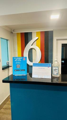 two boxes sitting on top of a counter with a sign at Studio 6 Suites San Ysidro CA San Diego South Bay in San Ysidro, San Diego