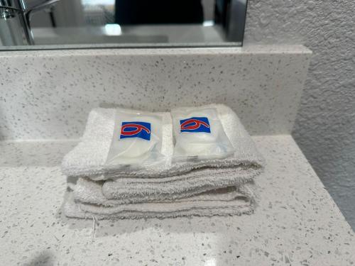 a couple of towels sitting on top of a bathroom counter at Studio 6 Suites San Ysidro CA San Diego South Bay in San Ysidro, San Diego