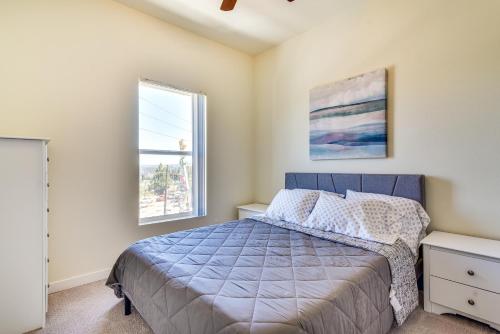 a bedroom with a blue bed and two windows at Portland Apartment about 1 Mi to Downtown! in Portland
