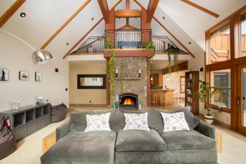 a living room with a couch and a fireplace at Look Out Lodge - On North Shore w Lake View, Hot Tub, Pool Table and Pet Friendly in Kings Beach