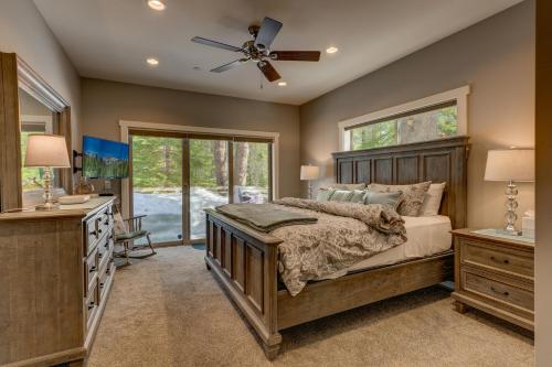 a bedroom with a bed and a dresser and a window at Mountain Jewel in Tahoe Donner - Beautiful 4 Bedroom w Hot tub, Access to HOA Amenities in Truckee