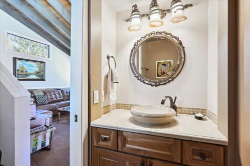 a bathroom with a sink and a mirror at On the Edge at Alpine Meadows - Fireplace- Mountain Views- Great Location! Shuttle Service! in Olympic Valley
