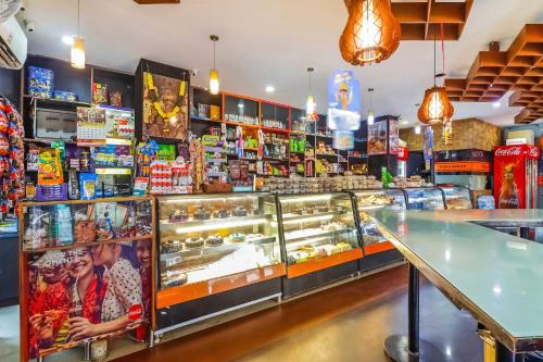 a shop with a display case filled with food at Collection O 68894 Bommarillu Residency (VIVA Residency) in Trimulgherry