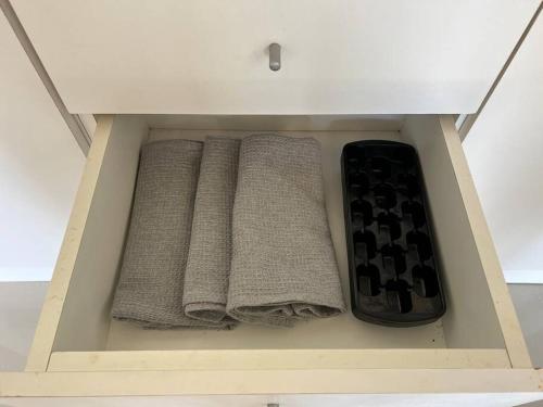 three towels in a drawer of a cabinet at Arenas Garzón in José Ignacio