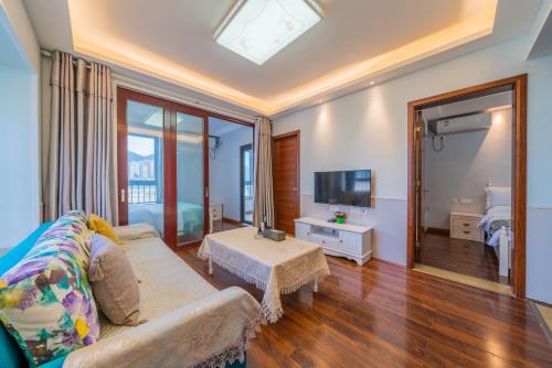 TV a/nebo společenská místnost v ubytování Yue Ke Apartment - Changbin Road Branch