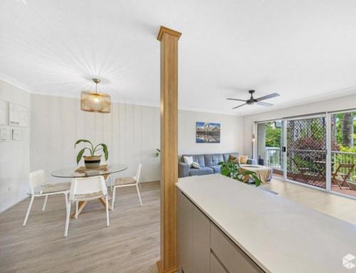 a kitchen and living room with a table and chairs at Mari Court Resort in Gold Coast