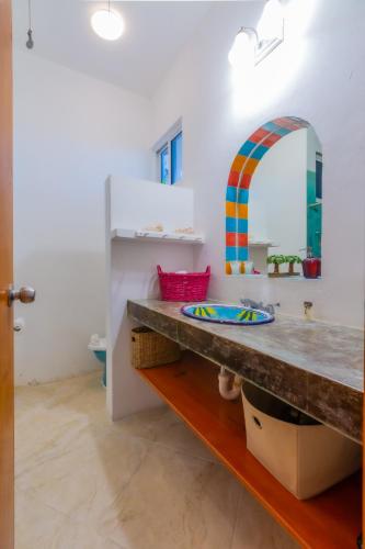 a bathroom with a sink and a mirror at Casa Cielo 2 Bedroom Oceanfront Villa in Isla Mujeres