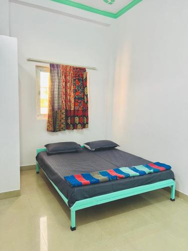 Ένα ή περισσότερα κρεβάτια σε δωμάτιο στο Bhoora House