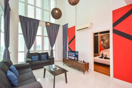 a living room with a couch and a large mirror at 1Medini Theme Suite by Nest Home【LEGOLAND】 in Nusajaya
