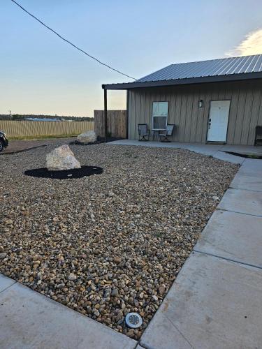 a gravel yard in front of a building at Canadian river villas in Amarillo